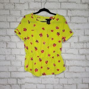 attention bright yellow floral blouse
